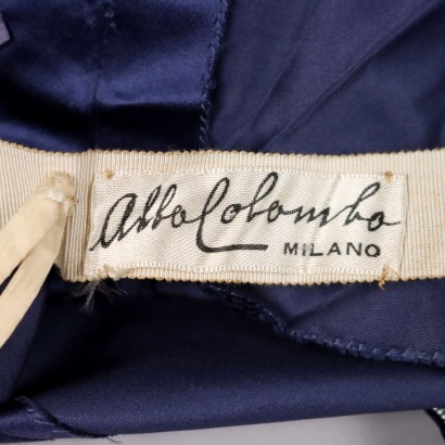 Robe vintage en satin bleu avec sac à main