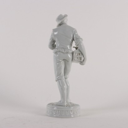 Young Man with Cage Porcel Figurine