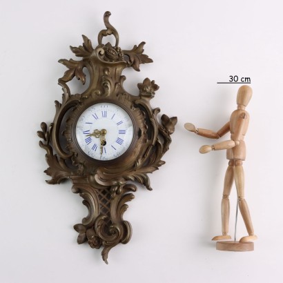 Reloj de pared de bronce dorado